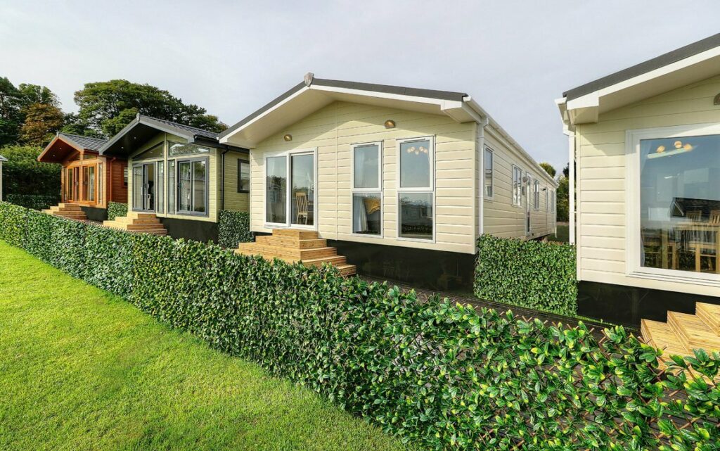 static caravan homes behind hedge