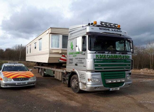 static caravan on transport lorry