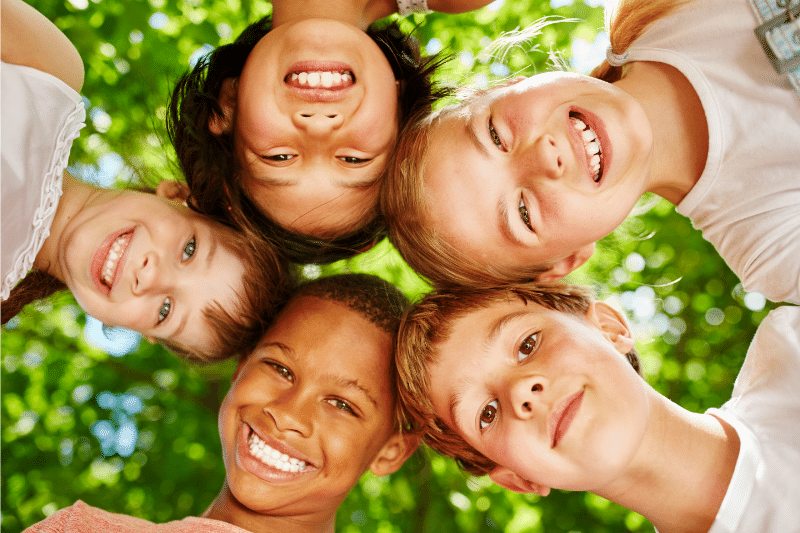 smiling kids looking at camera