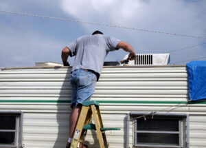 Man working on static caravan