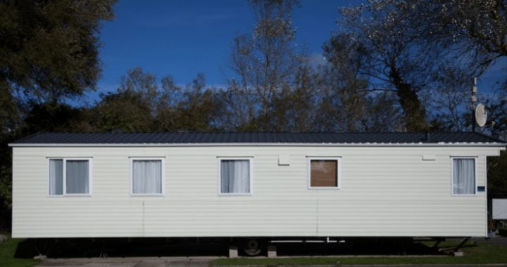 Long, white static caravan