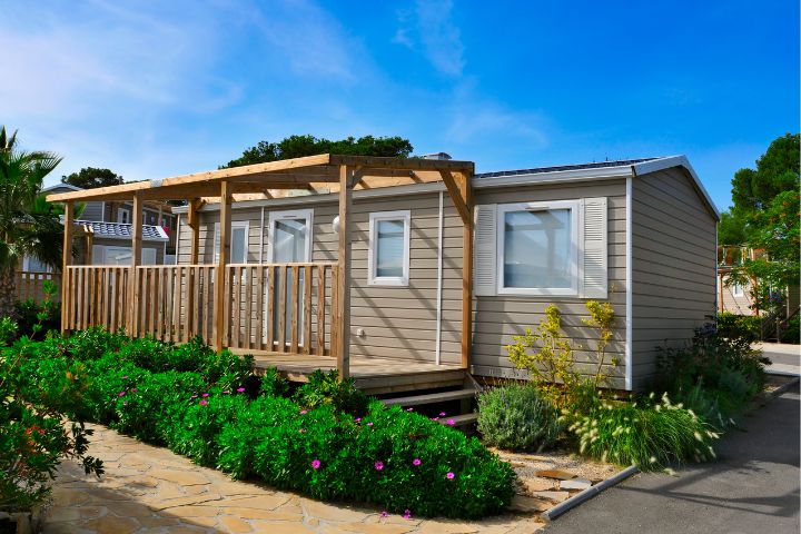 Static caravan with decking and pergola and plants