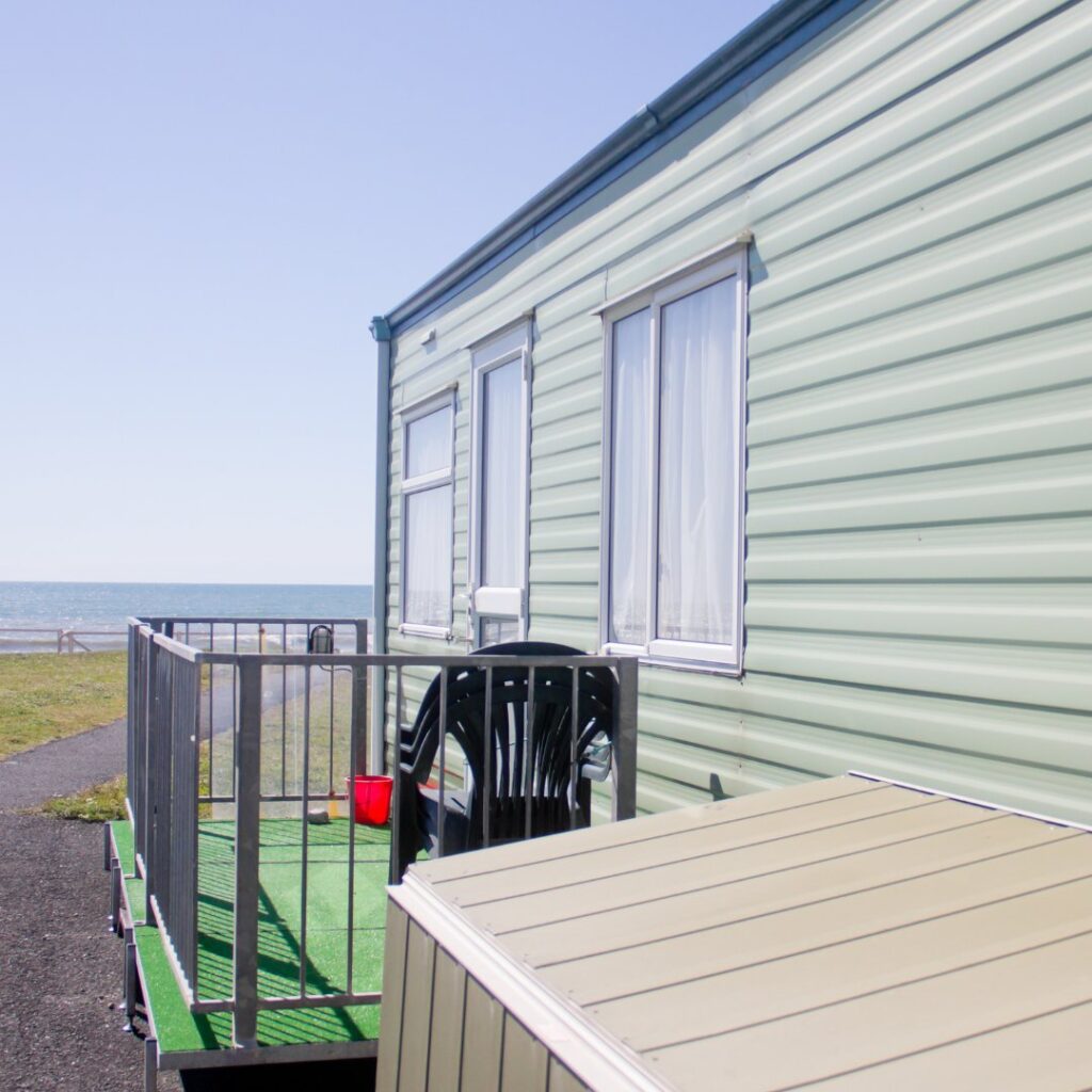 static caravan home with metal decking area